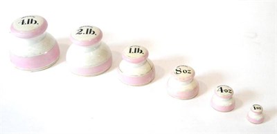 Lot 60 - Ceramic 4LB Weight Set consisting of 4lb, 2lb,1lb, 8oz, 4oz and 1oz, all in white/pink finish...