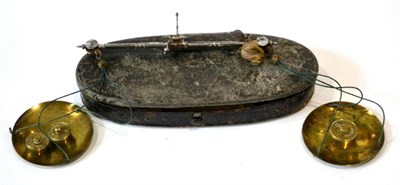 Lot 63 - Coin Scales consisting of hand held pan scales with circular brass pans in elliptical metal...