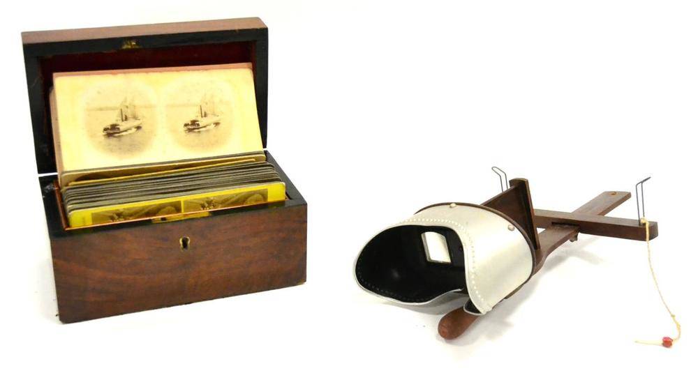 Lot 109 - Monarch Hand Held Stereo Viewer with a mahogany box containing various views