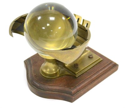 Lot 18 - Campbell-Stokes Early Sunshine Recorder constructed in brass with vertical sphere holder (the...
