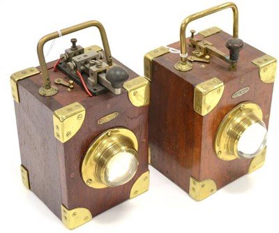 Lot 24 - Ever Ready A Pair Of Signalling Lamps constructed in wood with brass fittings, bullseye lens...