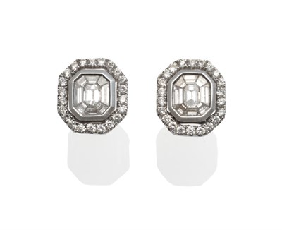 Lot 150 - A Pair of Diamond Cluster Earrings, an emerald-cut diamond tension set within a border of...