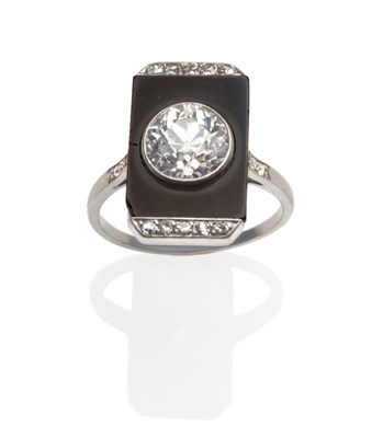 Lot 152 - ~ An Art Deco Cluster Ring, an old cut diamond centres an onyx panel with eight-cut diamond accents