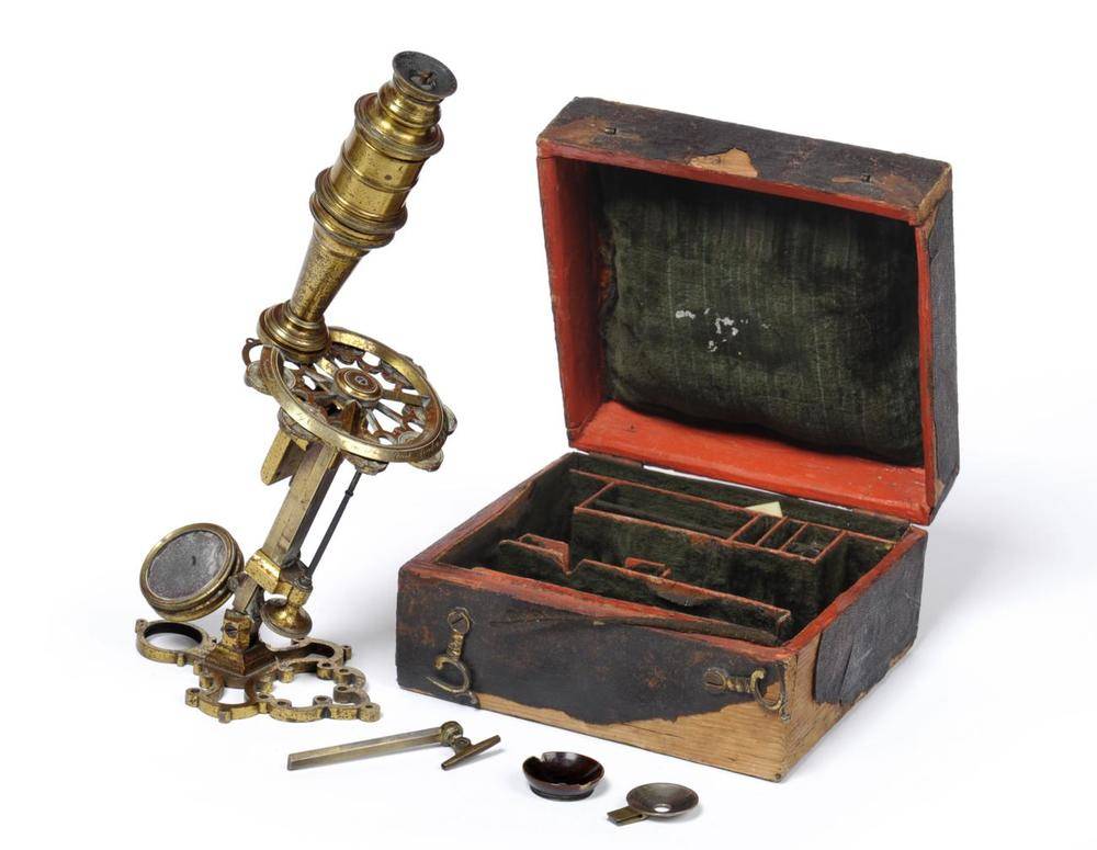 Lot 64 - A rare example of a George Adams ";New Universal"; microscope, the brass compound tube is...