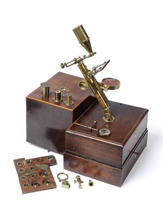 Lot 65 - An early 19th century Gould type compound microscope mounted on a mahogany box with two drawers...