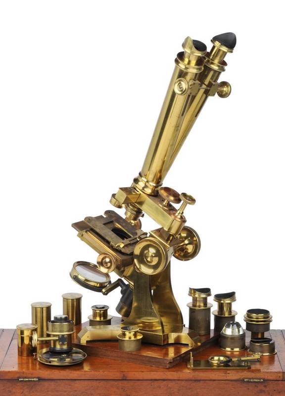Lot 82 - A Victorian brass compound binocular microscope by C. Collins, Portland street, London. Standing on