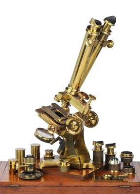 Lot 82 - A Victorian brass compound binocular microscope by C. Collins, Portland street, London. Standing on