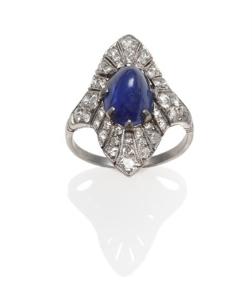 Lot 155 - An Art Deco Sapphire and Diamond Cluster Ring, a cabochon sapphire within a pierced mount pavé set