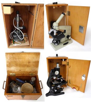 Lot 102 - Microscopes a collection of three student microscopes (all cased) together with a Cambridge...