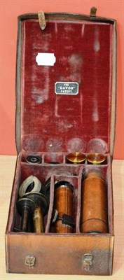 Lot 119 - A Davon Patent Micro-Telescope, the body with stitched leather sleeve, with eyepieces,...
