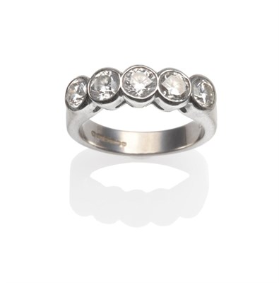 Lot 160 - An 18 Carat White Gold Diamond Five Stone Ring, the round brilliant cut diamonds in white...
