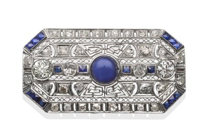 Lot 161 - ~ An Art Deco Style Sapphire and Diamond Brooch, a central cabochon sapphire and old cut...