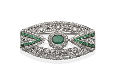 Lot 166 - ~ An Art Deco Style Emerald and Diamond Brooch, the oval cut emerald within a pierced frame,...
