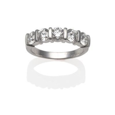 Lot 173 - An 18 Carat White Gold Diamond Five Stone Ring, the round brilliant cut diamonds in bar...
