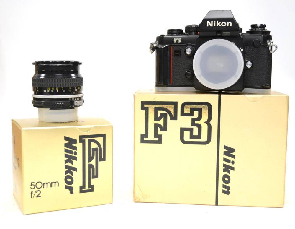 Lot 236 - Nikon F3 Camera Body together with a Nikkor f2, 50mm lens, both boxed (2)