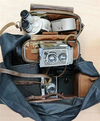 Lot 245 - Ten Cameras and Cine Cameras, including two Bell & Howell cine-cameras, in stitched leather...