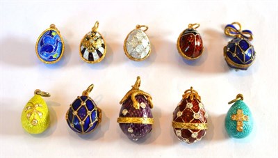 Lot 177 - ~ Ten Egg Charms, enamelled in assorted colours, some set with white paste stones, some hinged...