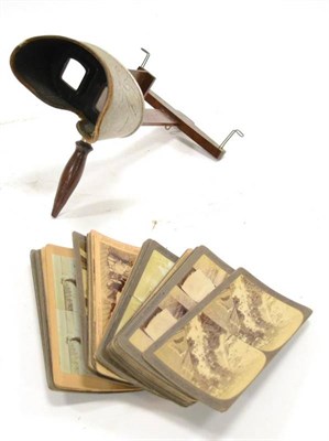 Lot 288 - Underwood & Underwood Hand-Held Stereo Viewer together with 35 cards with views including the...