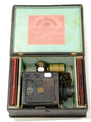 Lot 324 - Ernst Plank Childs Magic Lantern of tinplate construction with brass lens and spirit burner,...