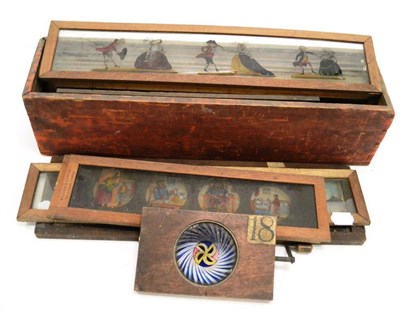 Lot 325 - Magic Lantern Slides a collection of long slides with multiple scenes on each slide (typically 3 or