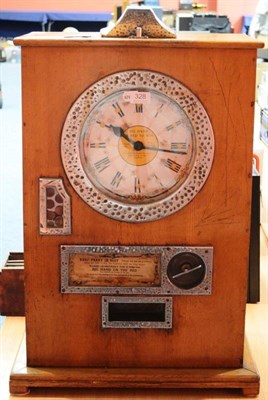 Lot 328 - Penny In The Slot Machine with clock face and when operated the hands spin with ";Big Hand On...