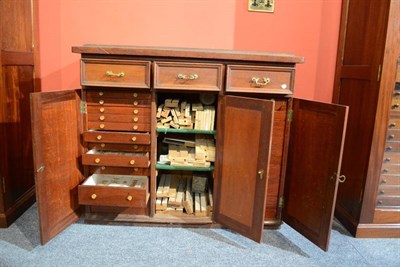 Lot 345 - A Mahogany Cabinet, containing three small drawers and central shelved section, and two tiers...