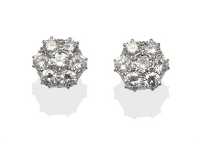 Lot 196 - A Pair of Diamond Cluster Earrings, seven round brilliant cut diamonds in white claw settings,...