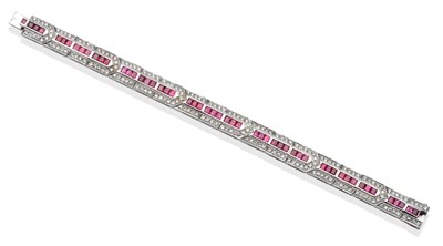 Lot 199 - ~ A Ruby and Diamond Bracelet, of geometric design, set with step cut rubies and round...