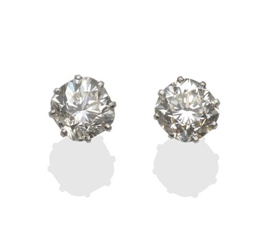 Lot 205 - A Pair of Diamond Solitaire Earrings, the cushion cut diamonds in white claw settings, on...