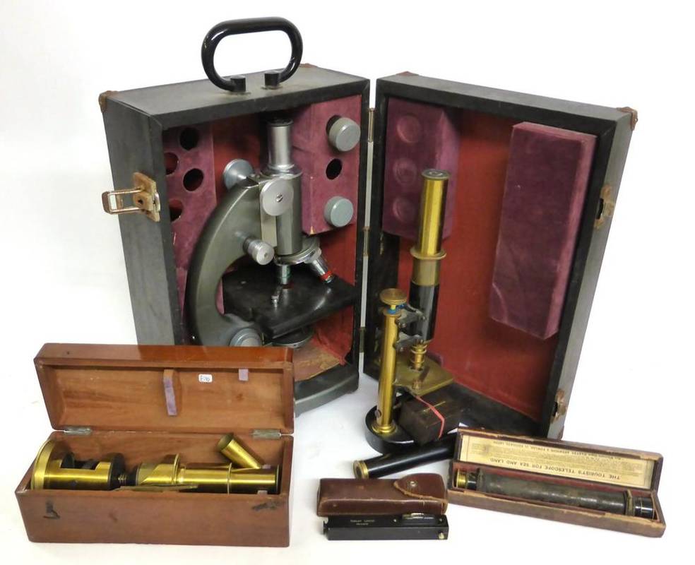 Lot 1024 - Seven Optical Instruments, comprising a lacquered brass drum microscope in mahogany case, a...
