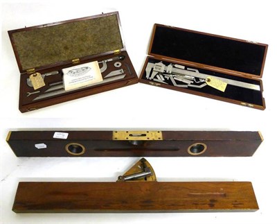 Lot 1047 - Four Instruments, comprising a Stanley No.30 adjustable wood and brass spirit level, a German...