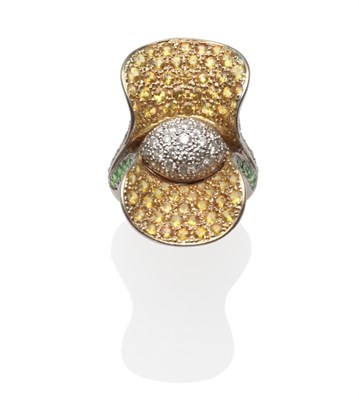 Lot 222 - A Flower Shaped Ring, pavé set with diamonds and yellow and green garnets, on a white plain...