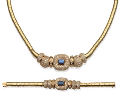 Lot 226 - ~ A Sapphire and Diamond Necklace and Bracelet Set, each with an emerald-cut sapphire within a...