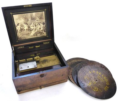 Lot 1131 - Polyphon Small Cased Disc Music Box with 4";, 10cm comb (all teeth appear intact) in walnut...