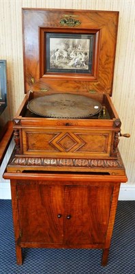 Lot 1132 - Polyphon Tabletop Disc Music Box with twin comb, wooden case with inlaid floral pattern to lid...