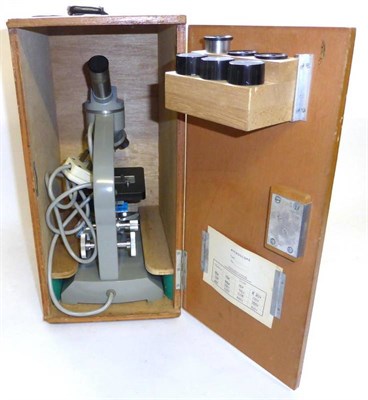 Lot 1193 - Prinz Optica Microscope with three lenses on swivel mount, integral lamp and concave/flat...