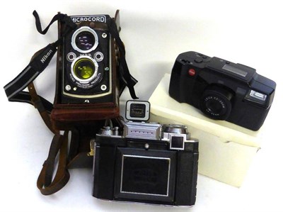 Lot 1216 - Three Cameras: Microcord MPP twin lens reflex in leather case, Zeiss Super Ikonta 533/14 and a...