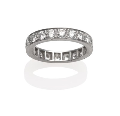 Lot 248 - A Diamond Eternity Ring, twenty round brilliant cut and old cut diamonds in white claws, on a...