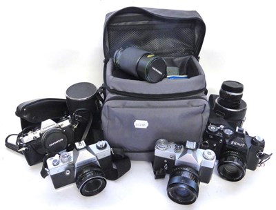 Lot 1234 - Zenit Cameras B and 11; Olympus OM10 (cased) three lenses in individual hard cases, Praktica...