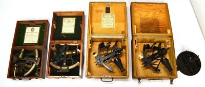 Lot 1031 - Four Cased Sextants, comprising a Husun brass triple ring sextant, with scope, in a mahogany...