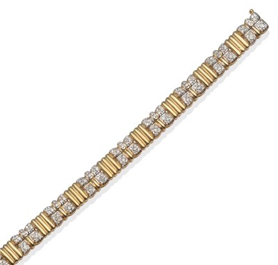 Lot 259 - ~ A Diamond Set Bracelet, pavé set diamonds in butterfly style motifs alternate with triple...