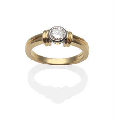 Lot 262 - An 18 Carat Gold Diamond Solitaire Ring, the round brilliant cut diamond in a white rubbed over...