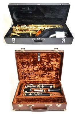 Lot 1105 - A Brass Jupiter 500 Series Tenor Saxophone, in a plush lined case, together with a Wooden Clarinet