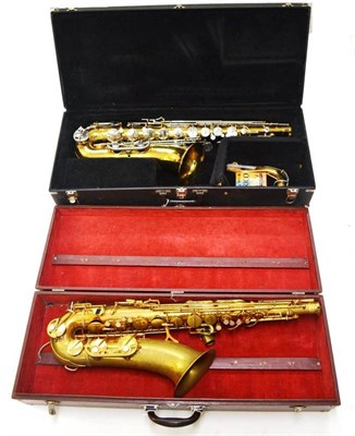 Lot 1115 - Four Cased Saxophones - silver plated alto Elkhart Buescher, Liozzan Paris brass alto, brass...