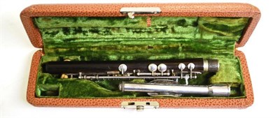 Lot 1116 - A Wooden Dolnet Lefevre Piccolo, with plated keys and mouthpiece, in a plush lined case