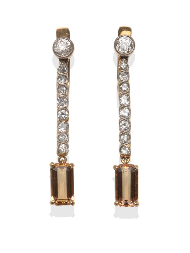 Lot 265 - A Pair of Diamond and Topaz Drop Earrings, an old cut diamond suspends a row of eight-cut, old...