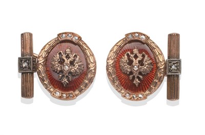 Lot 270 - ~ A Pair of Cufflinks, with eagle motif overlaid on red guilloche enamel, with diamond accents,...