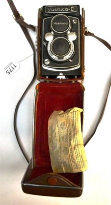 Lot 1175 - A Yashika-D Twin Lens Reflex Camera, serial number 3051299, in a stitched leather case