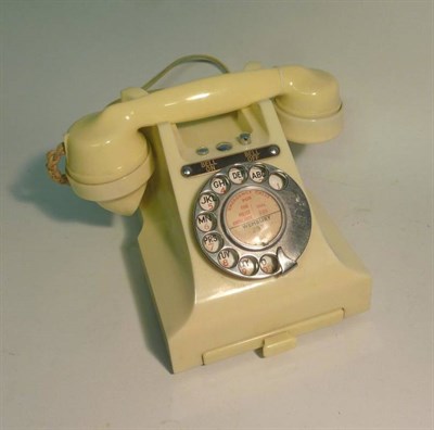 Lot 1004 - A GPO Ivory Bakelite Model 328CB Telephone, with chrome dial, Bell On and Bell Off buttons,...