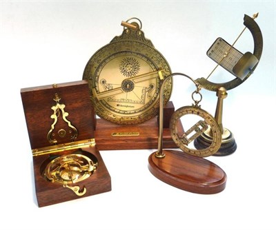 Lot 1022 - Four Modern Instruments, comprising a brass Universal Equatorial Dial, on a wooden base, a...